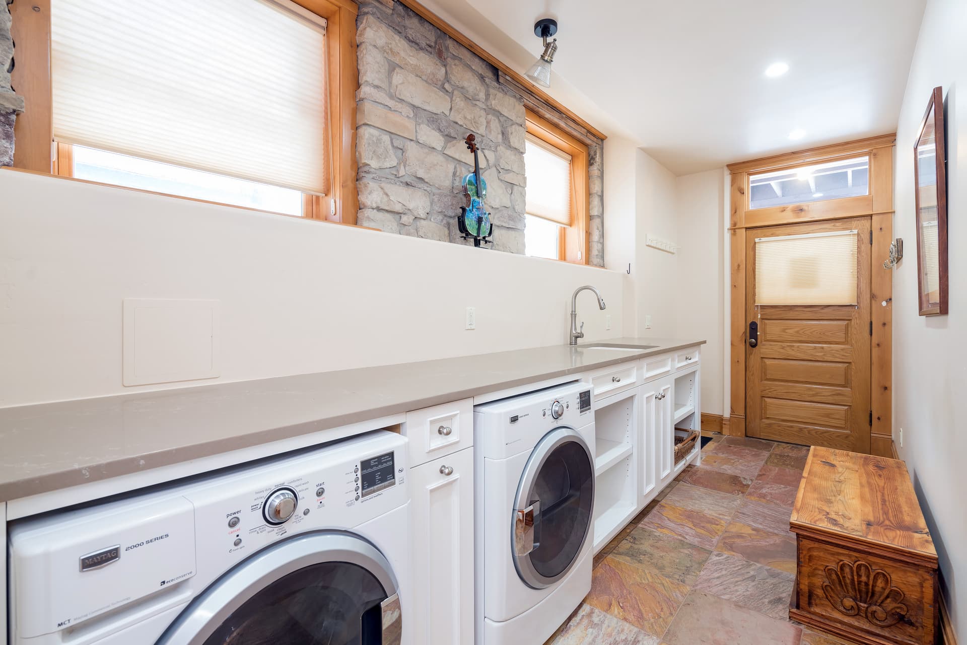 Hallway with washer and dryer